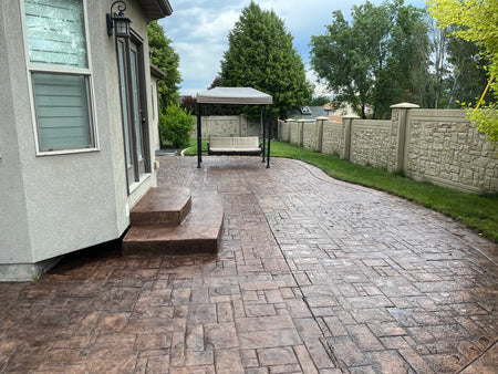 Restored 11-year-old stamped concrete patio finished with Chocolate EasyTint tinted sealer