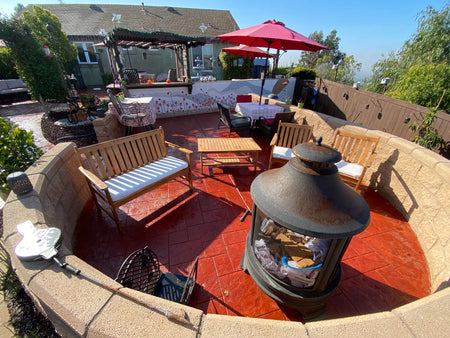 Faded integrally colored stamped concrete patio restored to a vibrant red with Crimson Antiquing Stain