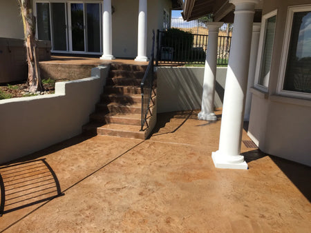 Multilevel covered stamped concrete patio and steps restored with Cumin Antiquing Stain