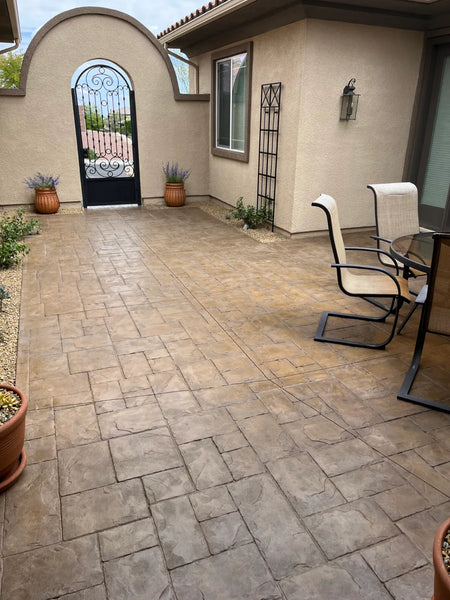 The same stamped concrete patio recolored with Tweed Antiquing stain