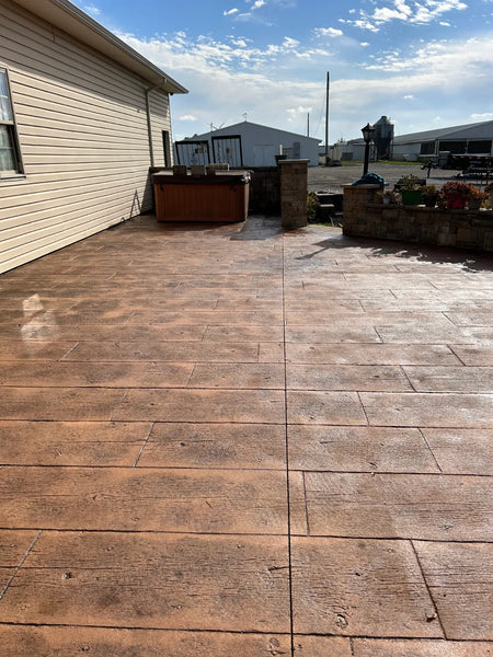 Wood-plank stamped concrete patio restored to a rich warm maple wood tone with Maple Antiquing stain and EasySeal Gloss