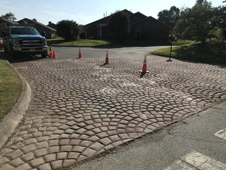 Faded and cracked entrance pavers before restoration