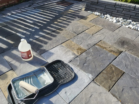 Slate-look stamped concrete pavers stained with Silver Gray, Light Charcoal, and Tweed Antiquing and sealed