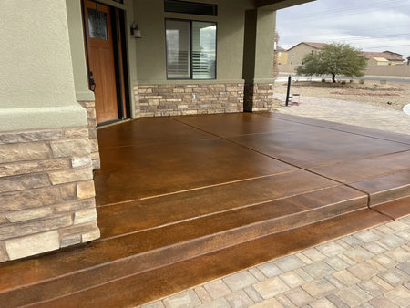 Front porch concrete brought to life with the deep hues of English Red and Coffee Brown