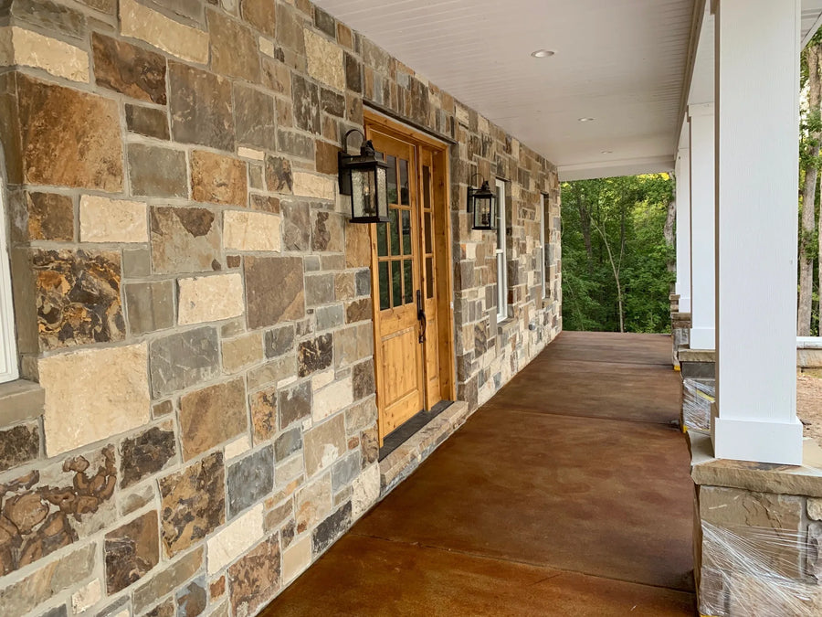 A finished front porch of an earthy brick estate home, enhanced by the warm hues of Cola EverStain™