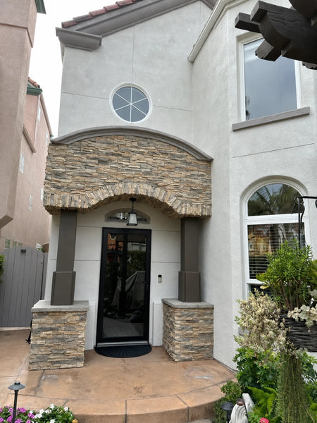 Faded tan concrete front porch and curved step before the Cumin color treatment