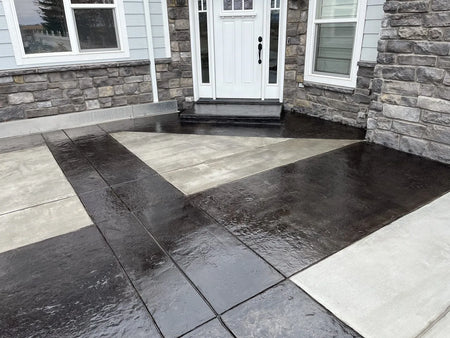 Image showcasing a scored concrete front porch stained with black EasyTint tinted sealer in a high gloss finish