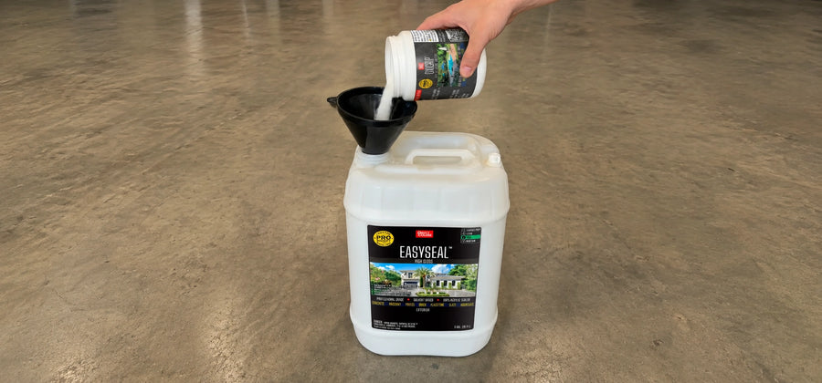 Contractor pouring EasySeal solvent-based acrylic concrete sealer into a clean mixing container in preparation for adding OxiGrip anti-slip additive before application
