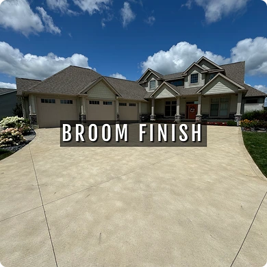 House with a driveway labeled 'Broom Finish'