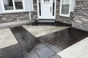 Stamped concrete front entry featuring a geometric design stained with Black EasyTint and finished with EasySeal Gloss