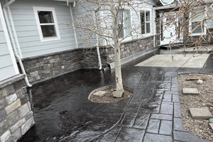 Curved stamped concrete front walkway and porch stained black with EasyTint and sealed with EasySeal Gloss