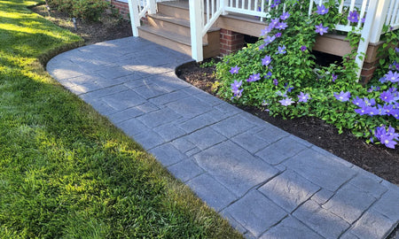 Freshly renovated sidewalk with charcoal antiquing stain and satin finish