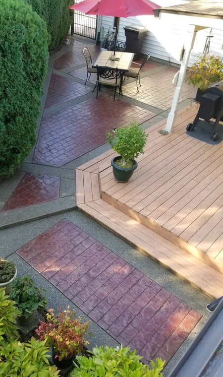 Revitalized patio area showing the finished stamped concrete surface stained with Cinnabar