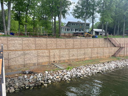 Completed staining of a large riverbank retaining wall with one coat of Cafe Royale EasyTint