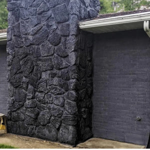 Dark gray limewash brick house finish