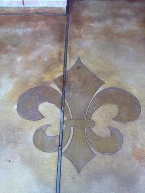 Coffee Brown Acid Stain Sprayed Onto Concrete Stencil Cut