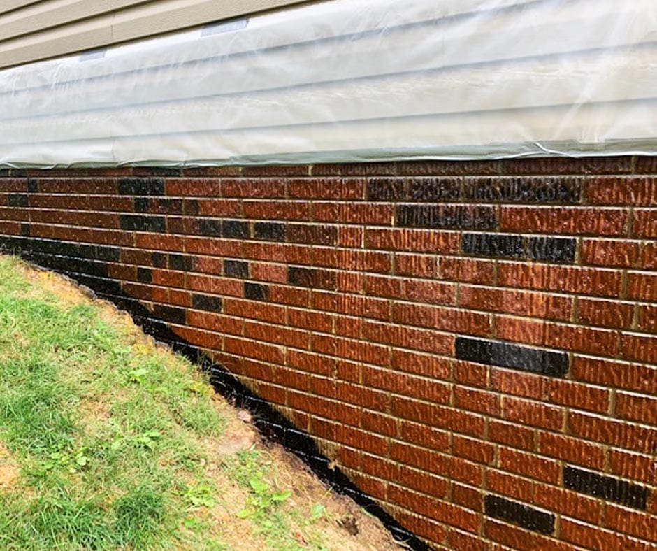 The finished stained faux brick wall, sealed with EasySeal for added protection and durability. The clear, solvent-based sealer preserves the color and finish of the concrete surface, while also providing resistance to water and stains.