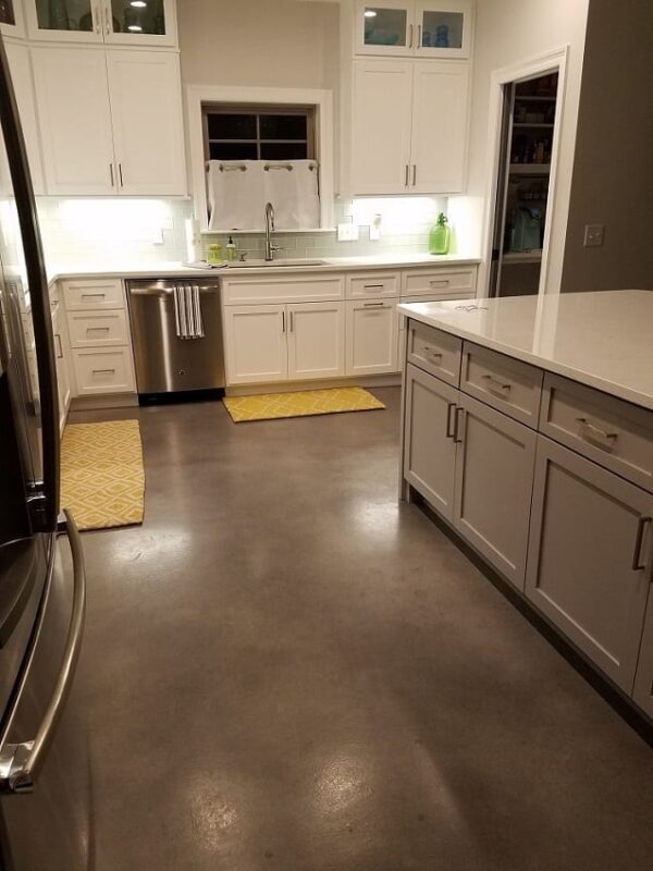 Sleek, modern concrete floor showcasing a blend of Stormy Gray, White, and Charcoal Vibrance Dye