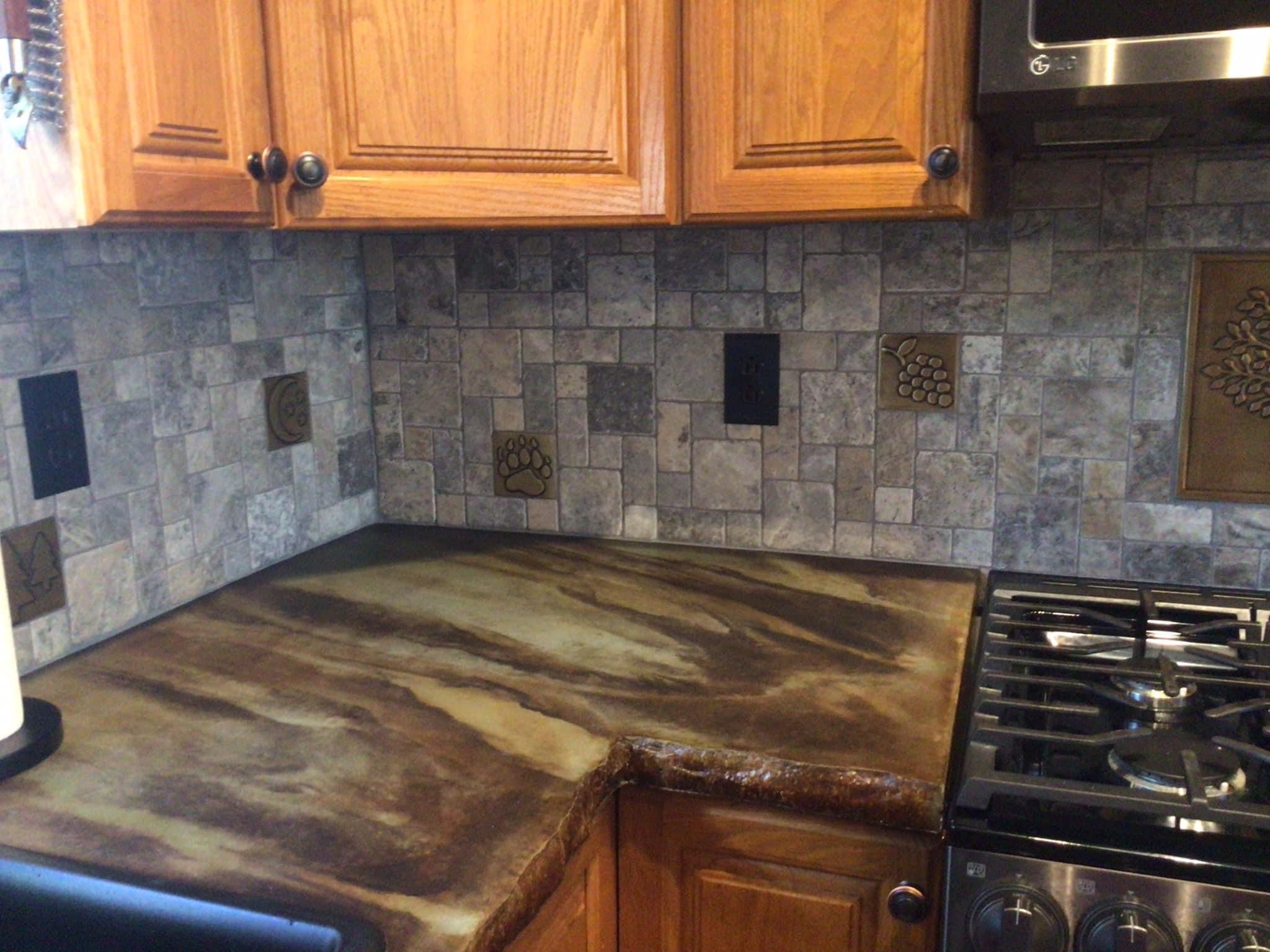 Rustic mottled kitchen concrete countertop acid stained with Coffee Brown, Seagrass, and Desert Amber colors