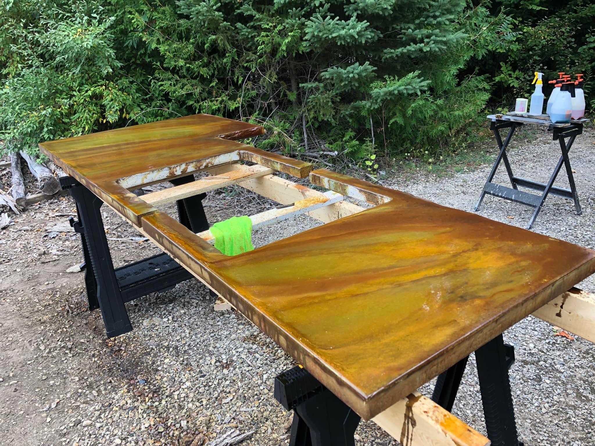 Acid staining poured in place concrete countertop with Coffee Brown, Seagrass, and Desert Amber colors