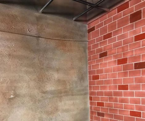 Faux Brick Stenciled Concrete Wall
