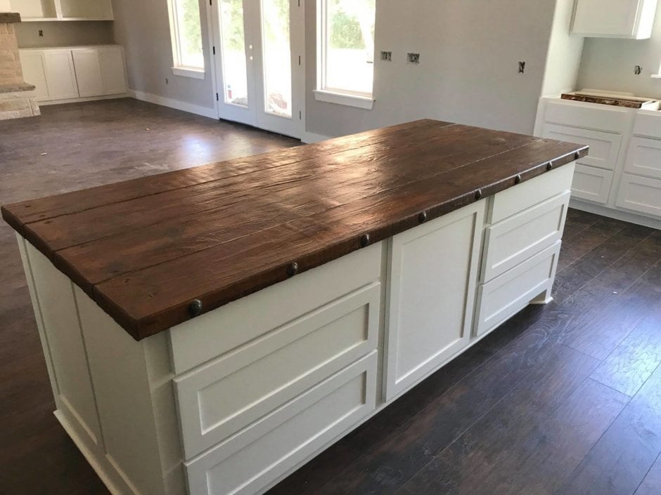Concrete kitchen island stained to look like wood