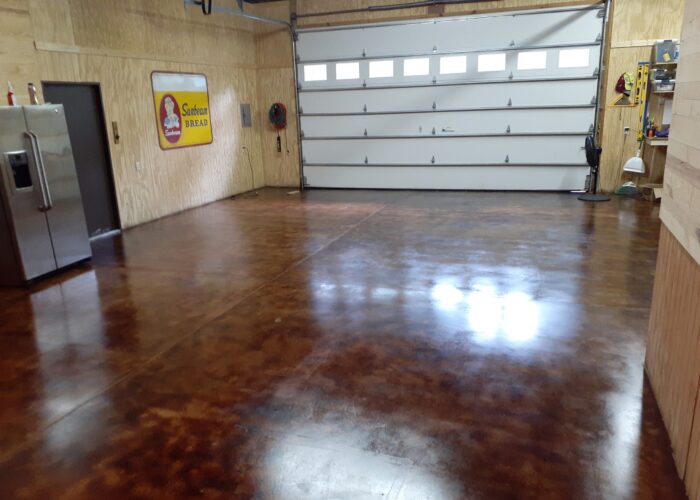Stunning final result of coffee brown acid stain concrete garage floor after applying high gloss EasySeal sealer.
