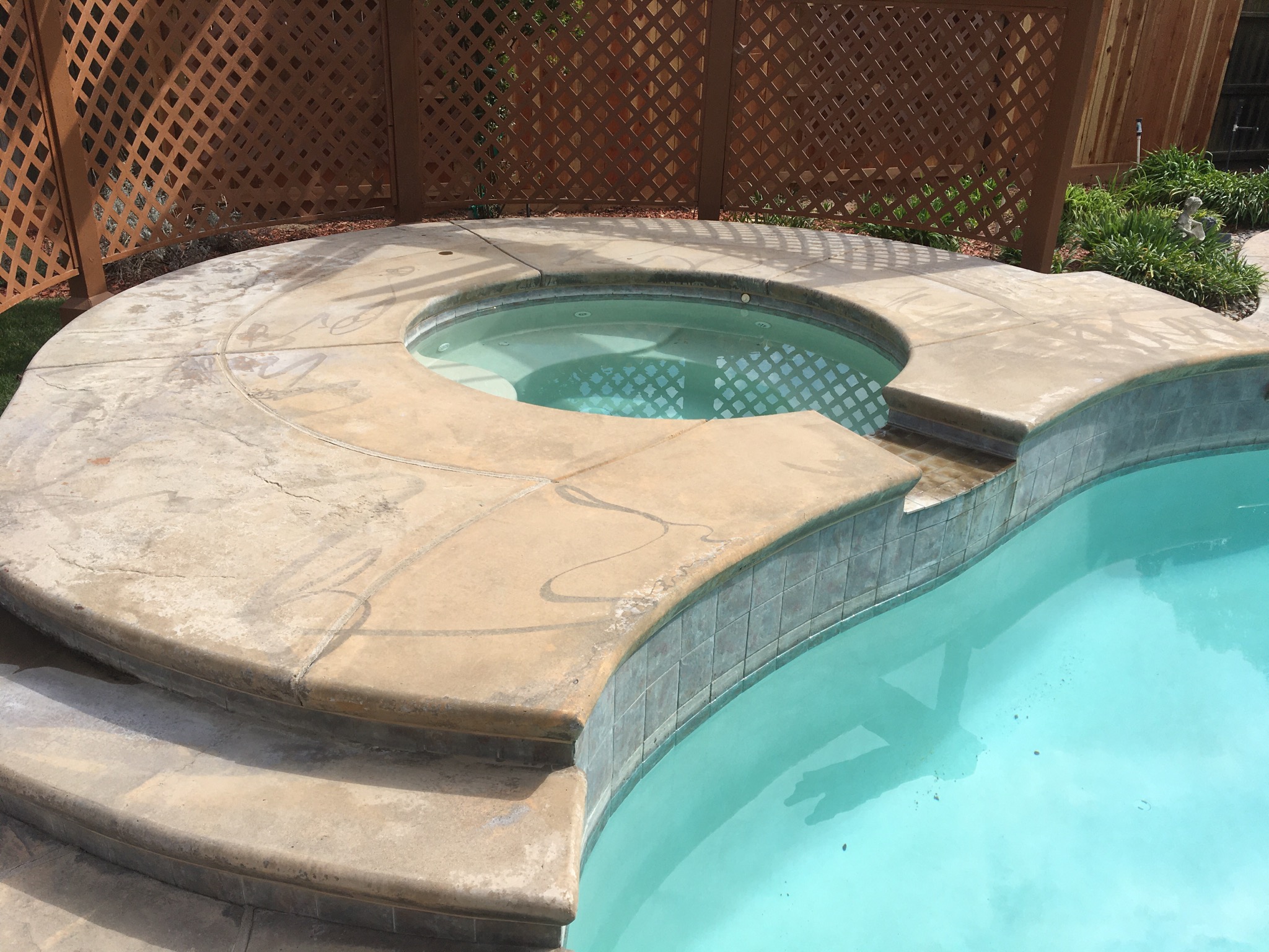 Faded Stamped Concrete Pool Deck Before Khaki Antiquing Stain