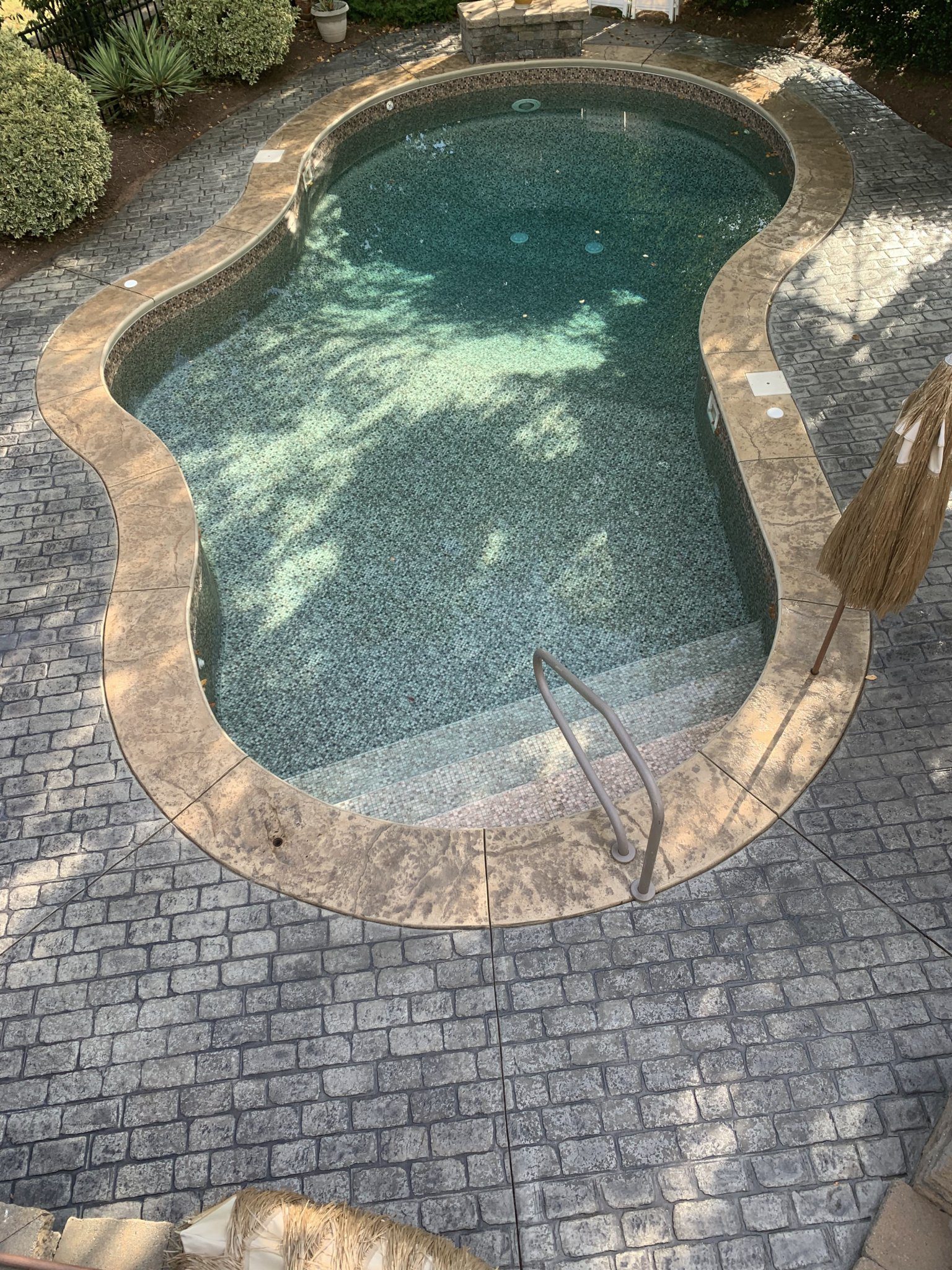 pool deck stained with Charcoal Antiquing Stain