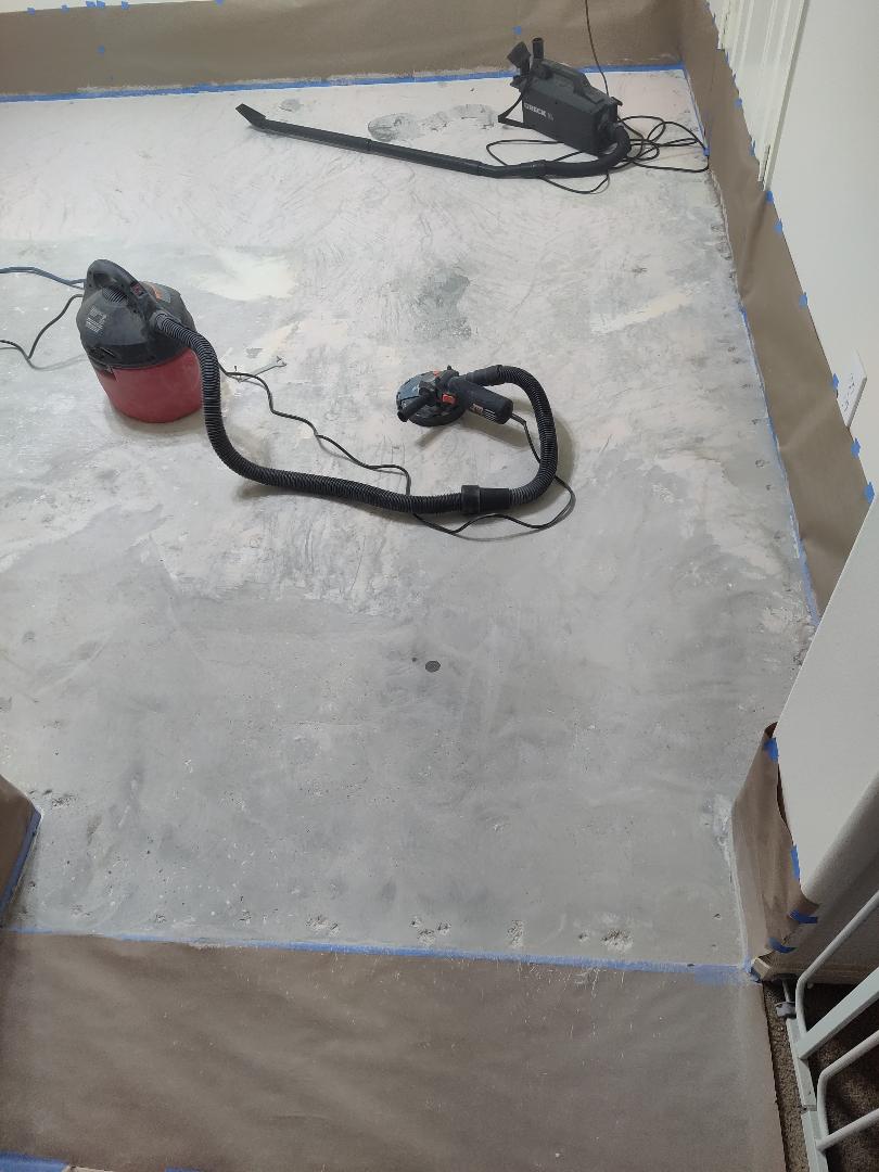 Removing carpet glue with a grinder
