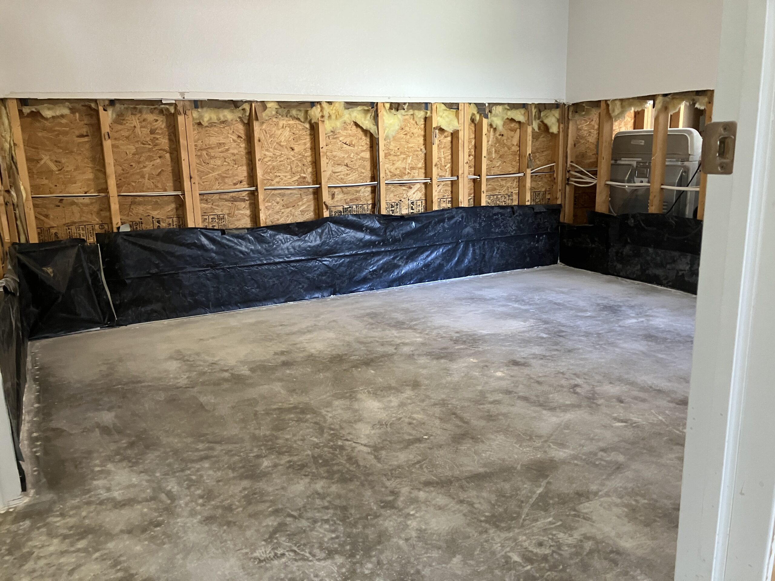 Damage left in the wake of Hurricane Ian – carpets and plank flooring entirely stripped away
