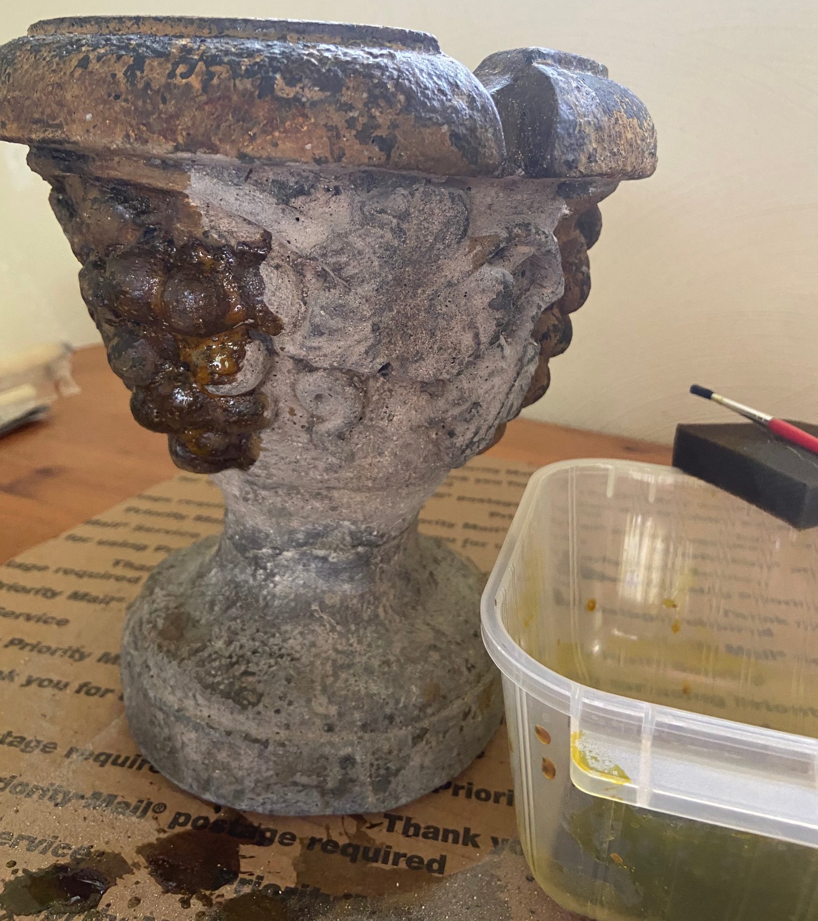 Restoration process of a three-tier fountain, showcasing the application of Coffee Brown EverStain Acid Stain using a paint brush