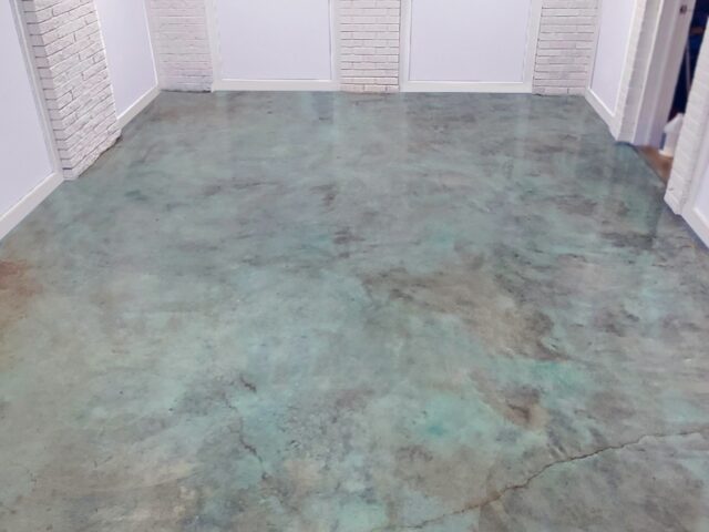 Stained concrete basement floor with Azure Blue EverStain acid stain