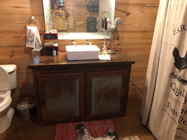 Detailed shot of a concrete vanity, artistically stained with Coffee Brown, complementing the bathroom's rustic charm