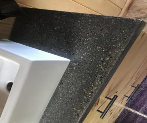 Integrally Colored Concrete Vanity with Smokestack Pigment and Stone Aggregate