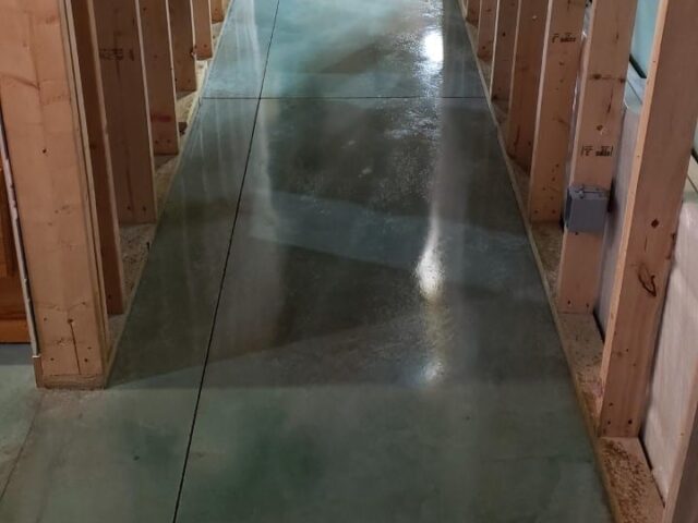 Azure blue and avocado acid stained concrete floor