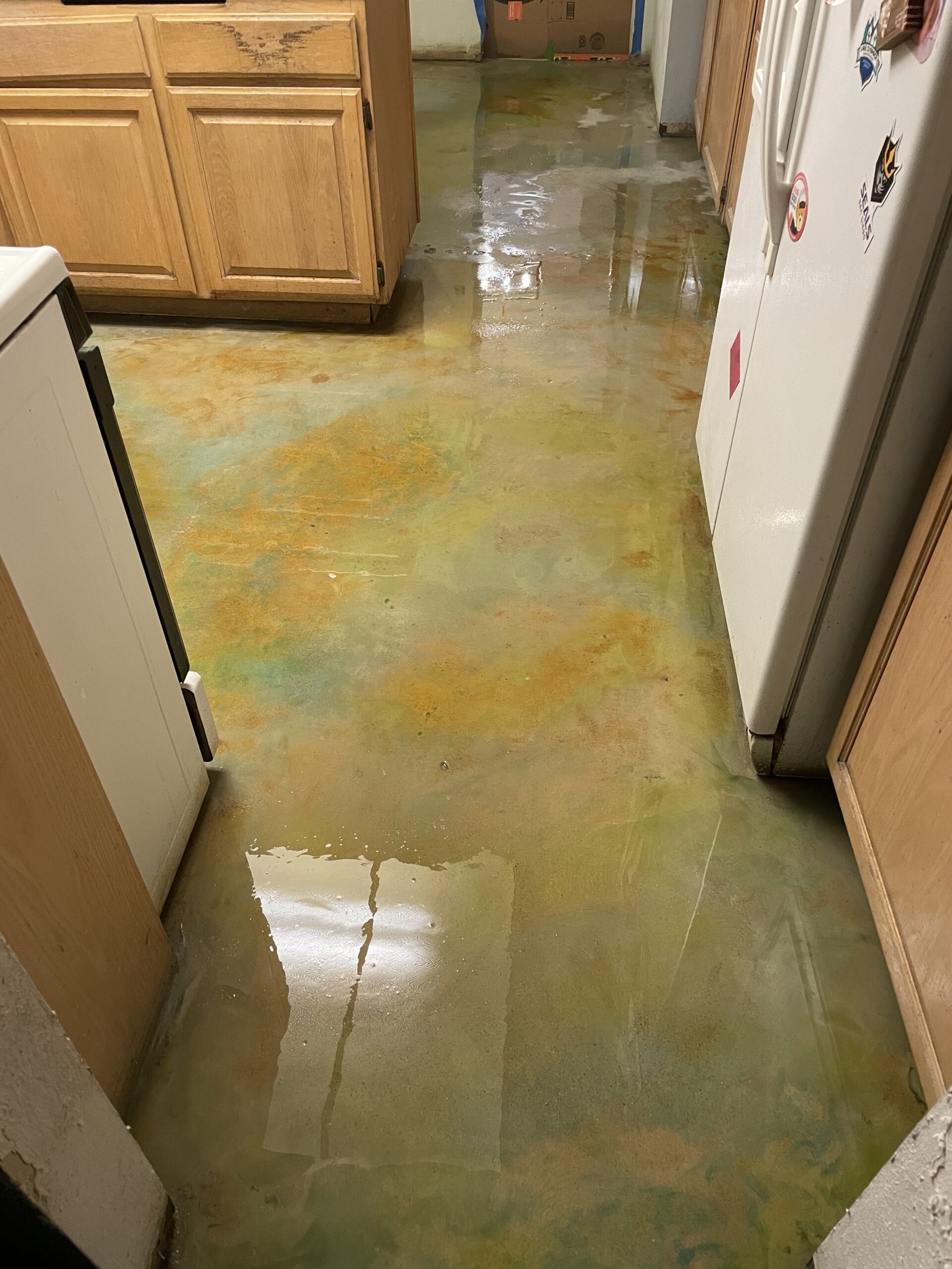 Acid stain on concrete floor while wet