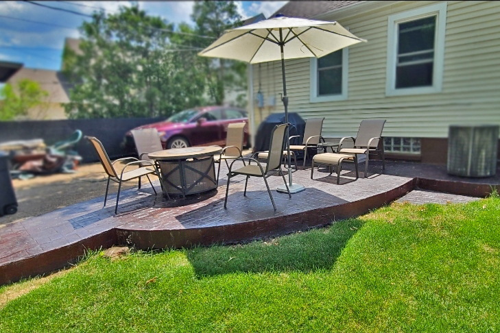 A deep and dramatic patio created with a mix of black and charcoal Antiquing stains to create a natural look that highlights the previous orange color