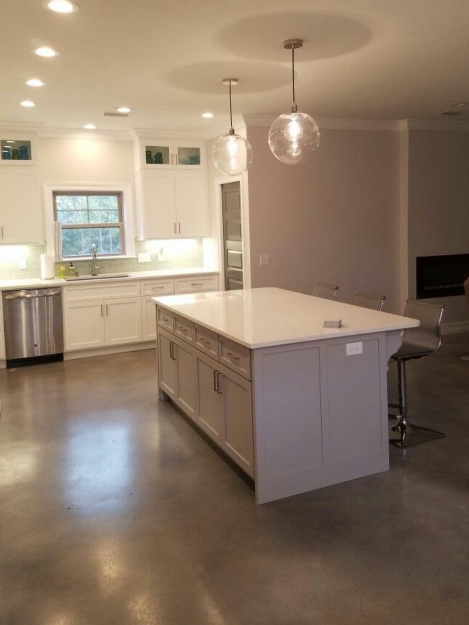 Faux polished concrete kitchen floor in Stormy Gray, White, Charcoal & Light Slate colors achieved using Vibrance Dye