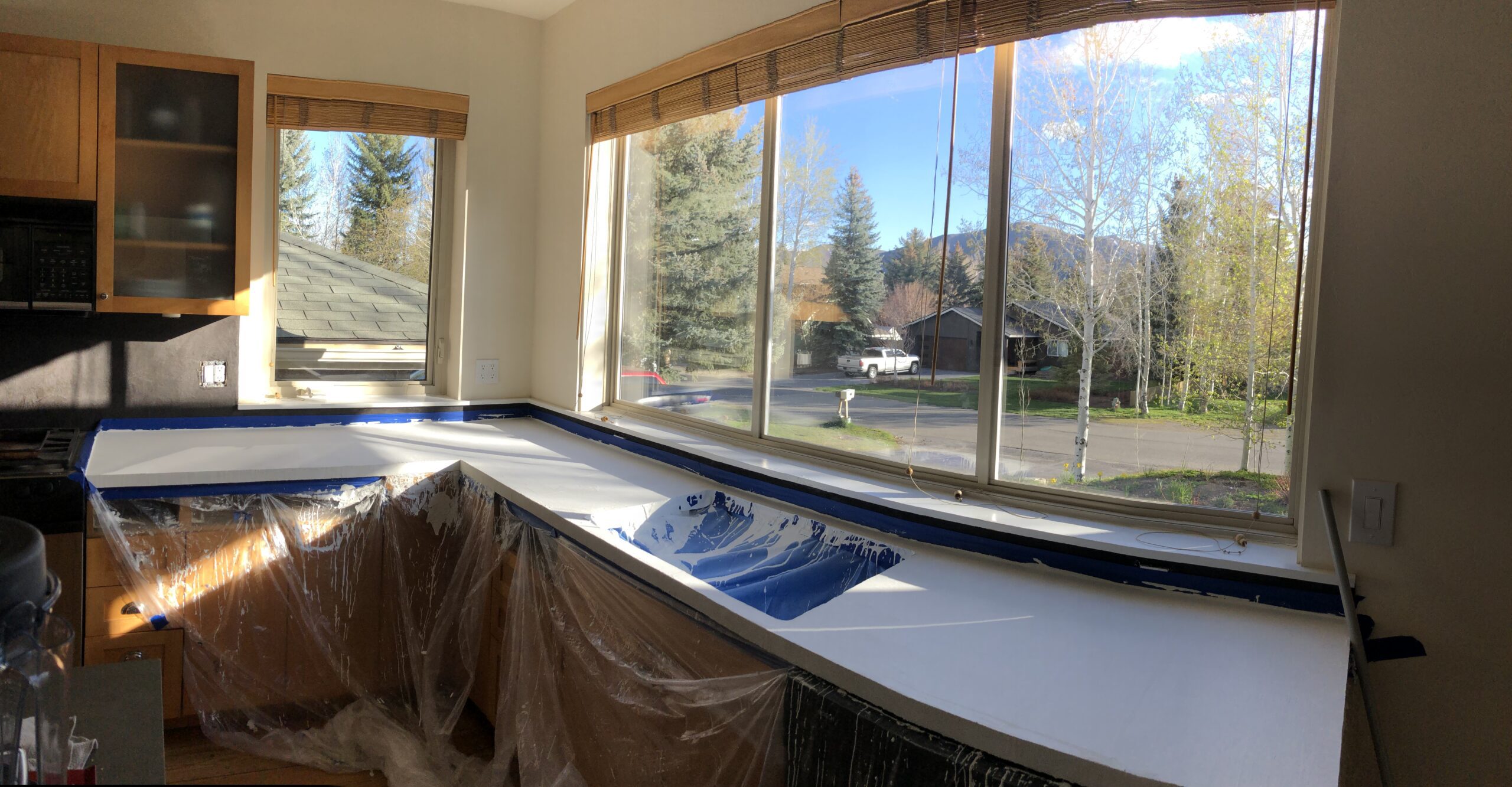 Kitchen countertop with a pearl white concrete overlay skimcoat applied over a Formica surface