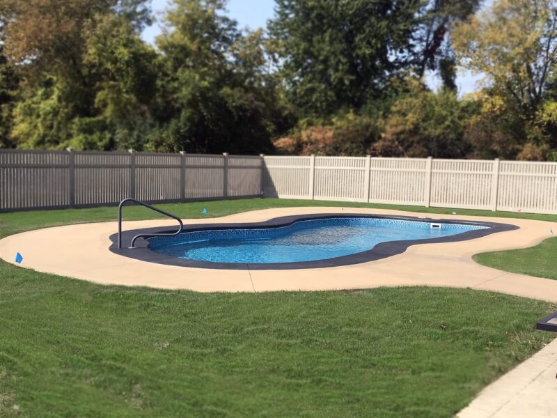 EasyTint charcoal stained coping & EasyTint Khaki stained broomed concrete pool deck