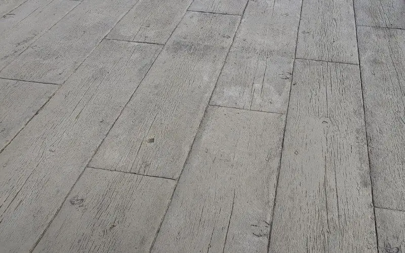 Stamped concrete overlay designed to look like wood planks