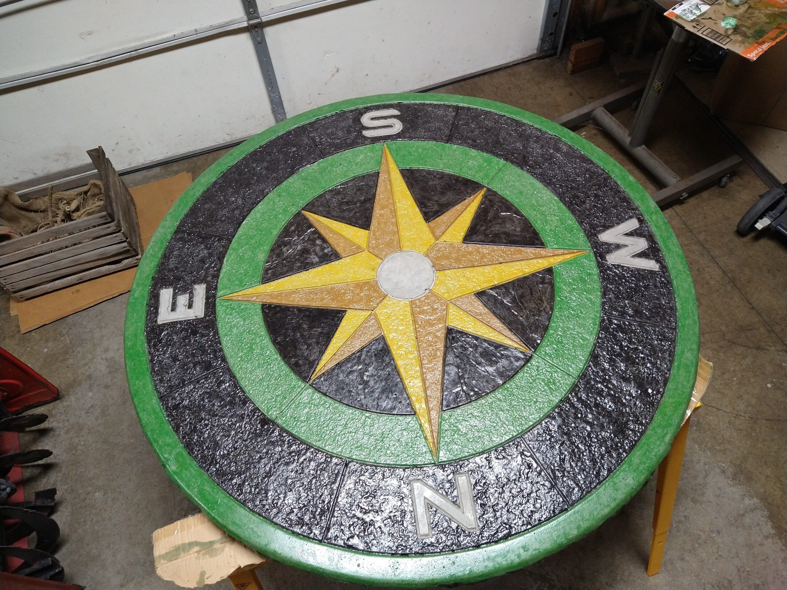 Concrete compass table design featuring Buff, Black, Fern Green, Goldenrod, and Wheat colors.