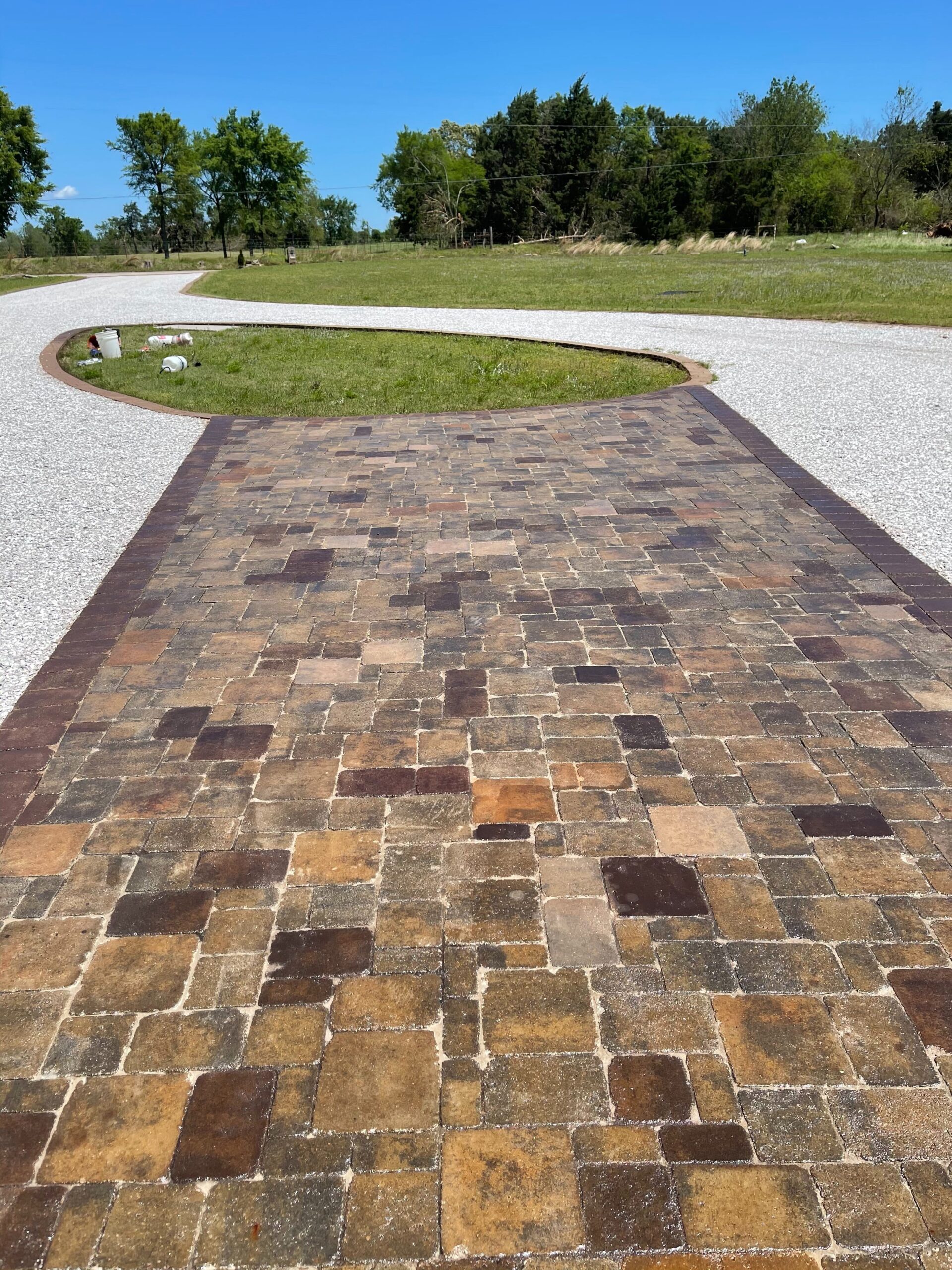 Multicolored paver driveway with Aztec Brown, Driftwood, Khaki, Yukon Gold and Terracotta concrete stains