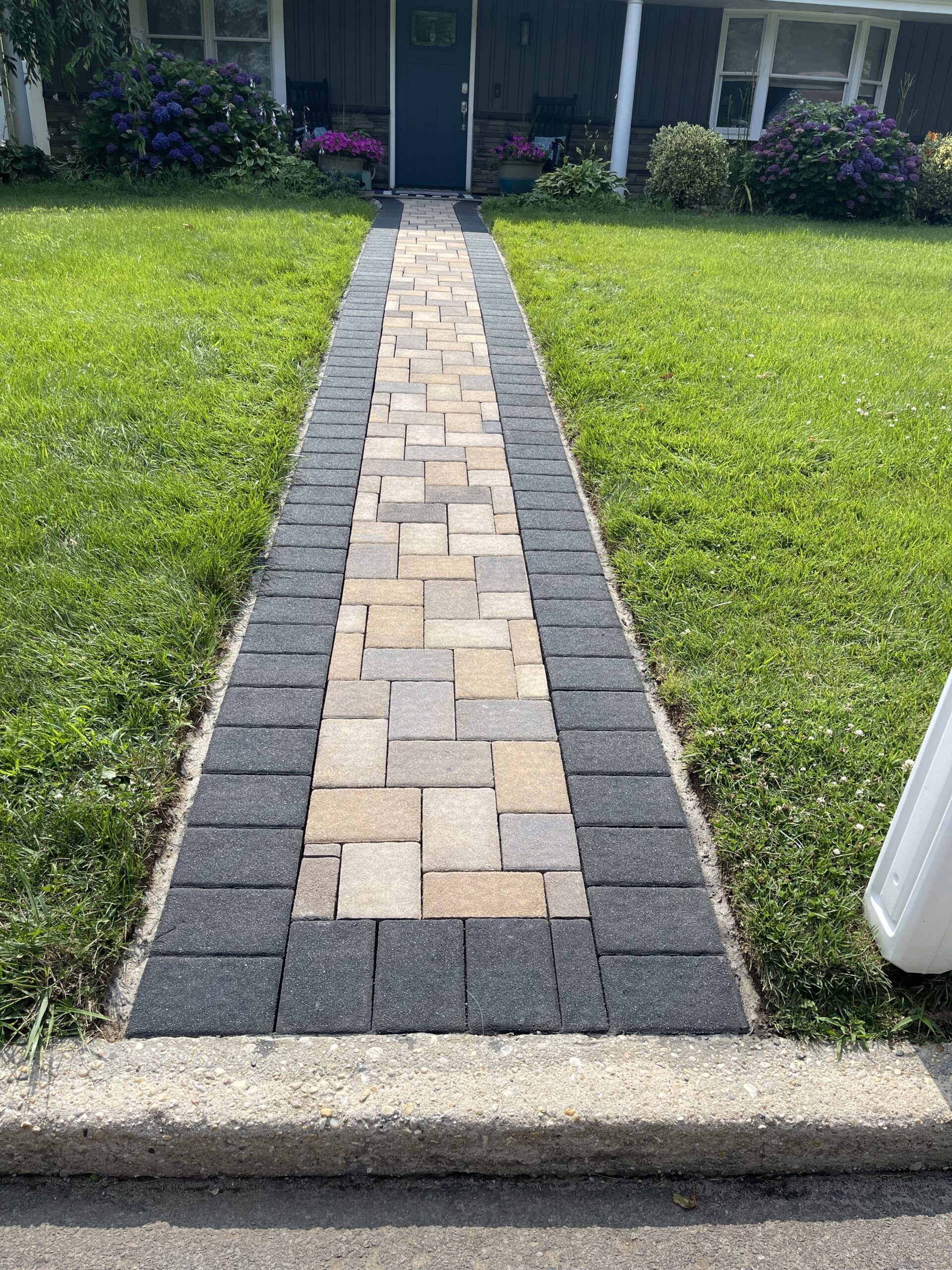 After renovation: Revitalized paver walkway stained with a blend of Buff, Charcoal, Khaki, and Silver Gray