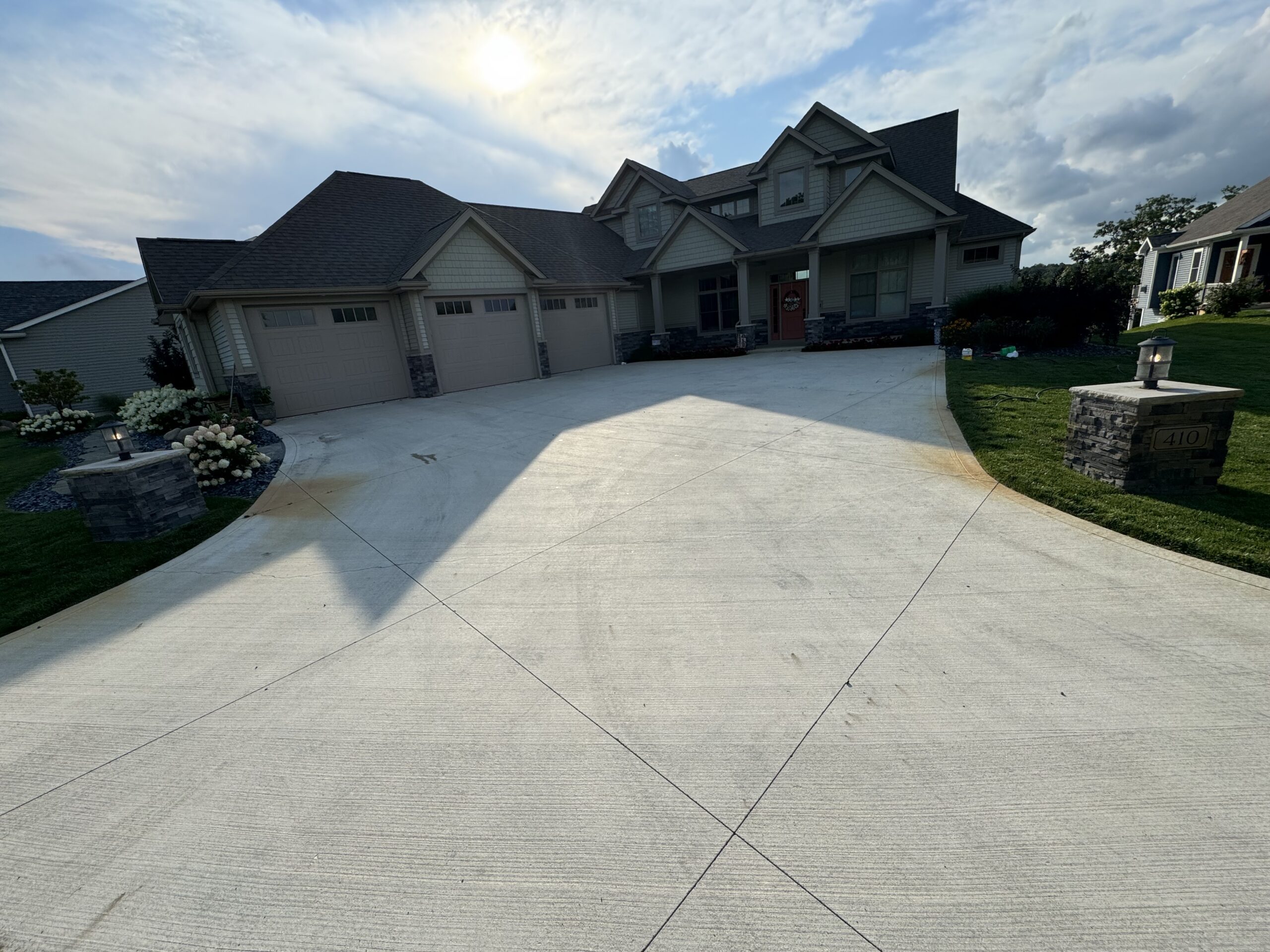 Before staining: Wide driveway with a broom finish before applying Buff Antiquing Stain