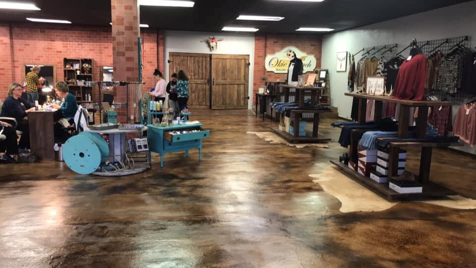 Coffee Brown Acid Stained Floors and Stenciled Concrete Overlay Walls