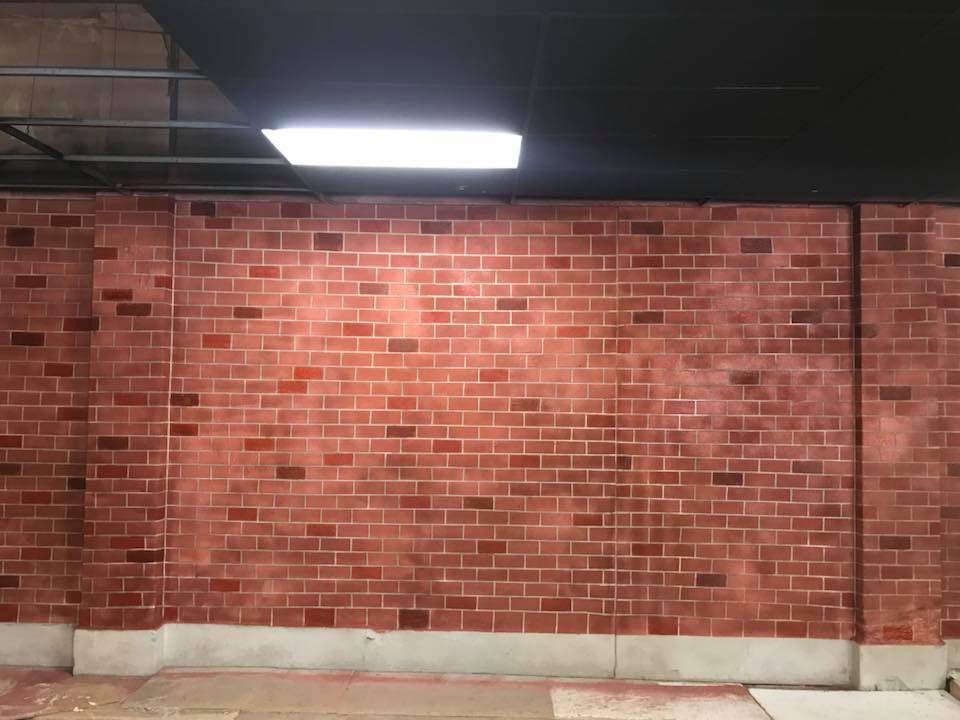 Faux Brick Stenciled Concrete Overlay Wall