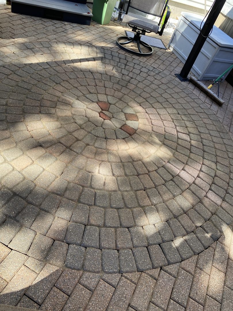 Faded concrete patio paver circle