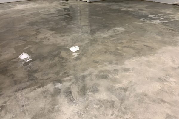 Allow concrete floor to dry before colored concrete sealer application